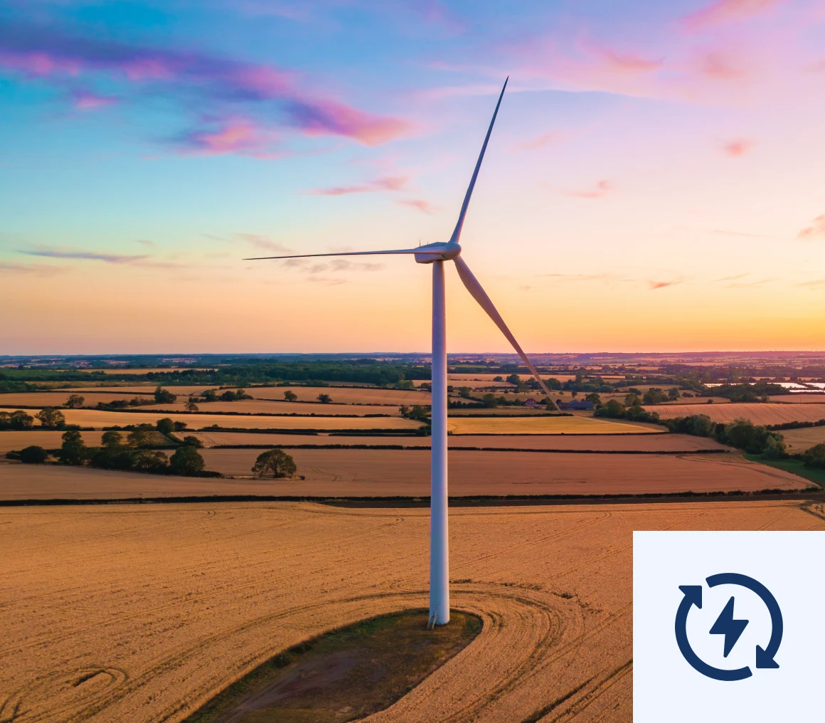 Wind turbine in sunset field